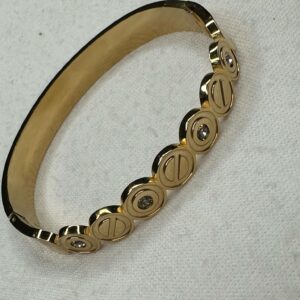 ✨ Brazalete Dorado con Detalles Circulares y Brillantes – Estilo Moderno y Sofisticado